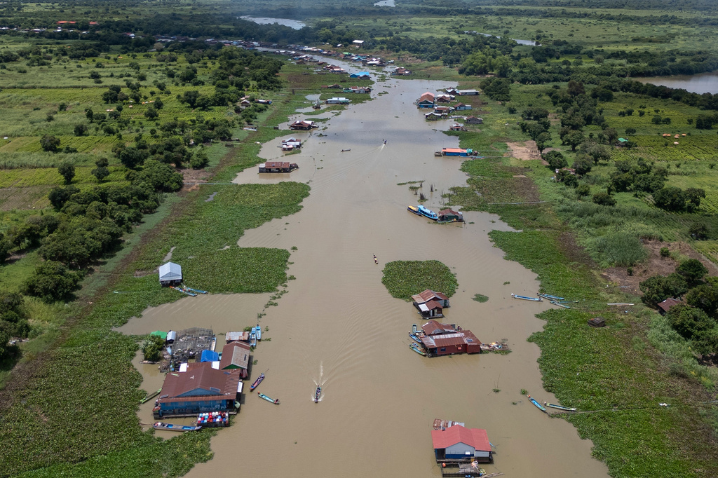 Boats traverse a floating village on Cambodia's Tonle Sap Lake on Monday, June 29, 2026. (AP Photo/Anton L. Delgado)