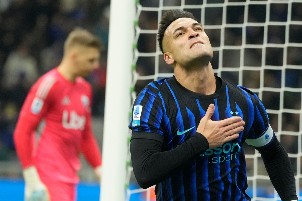 Inter Milan's Lautaro Martinez celebrates after scoring his side's first goal during a Serie A soccer match between Inter and Como, in Milan, Italy, Saturday, Dec. 6, 2025. (AP Photo/Luca Bruno)