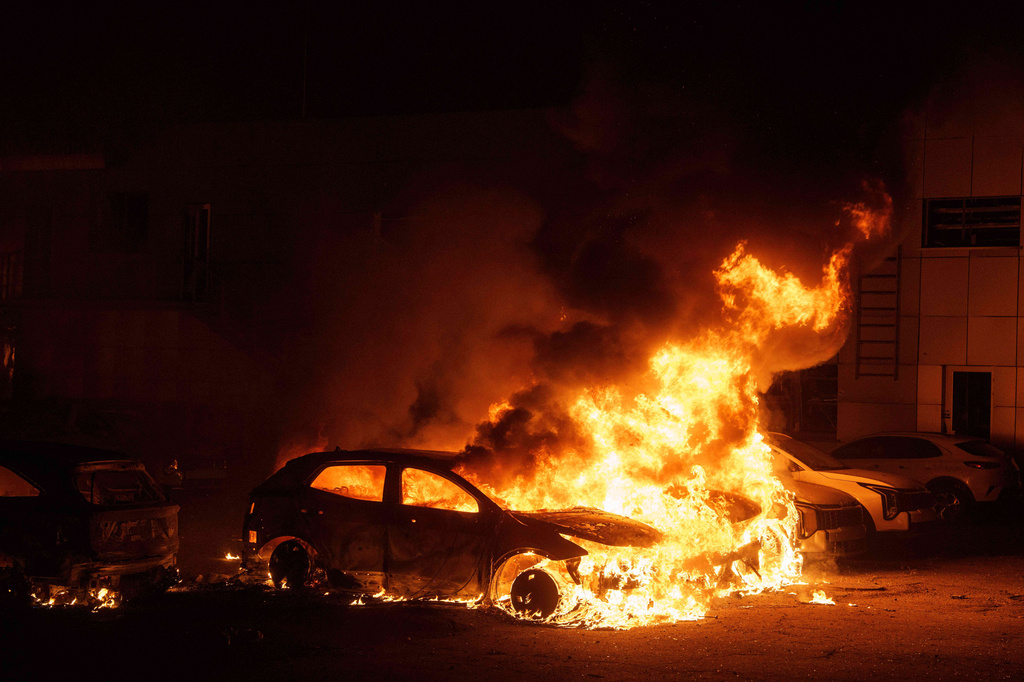 Cars burn after a Russian strike in Kyiv, Ukraine, on Thursday, April 16, 2026. (AP Photo/Evgeniy Maloletka)