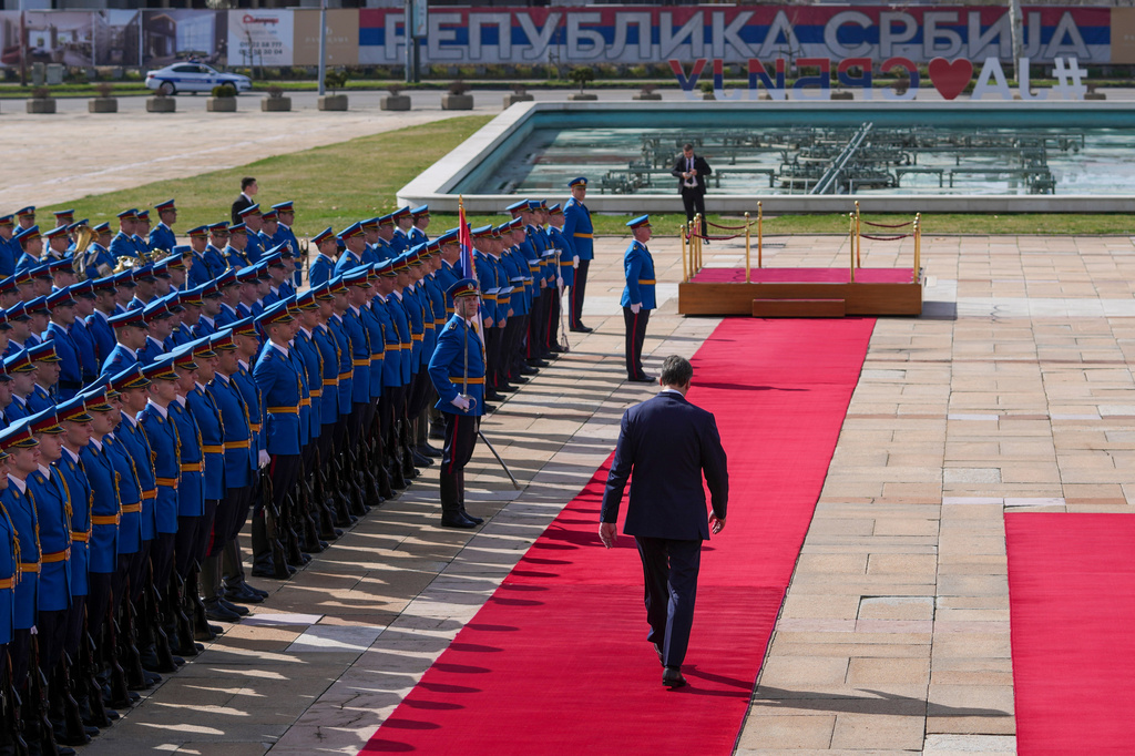 FILE - Serbian President Aleksandar Vucic walks on the red carpet before a welcoming ceremony for Burundi President Evariste Ndayishimiye at the Serbia Palace in Belgrade, Serbia, March 12, 2025. (AP Photo/Darko Vojinovic, File)