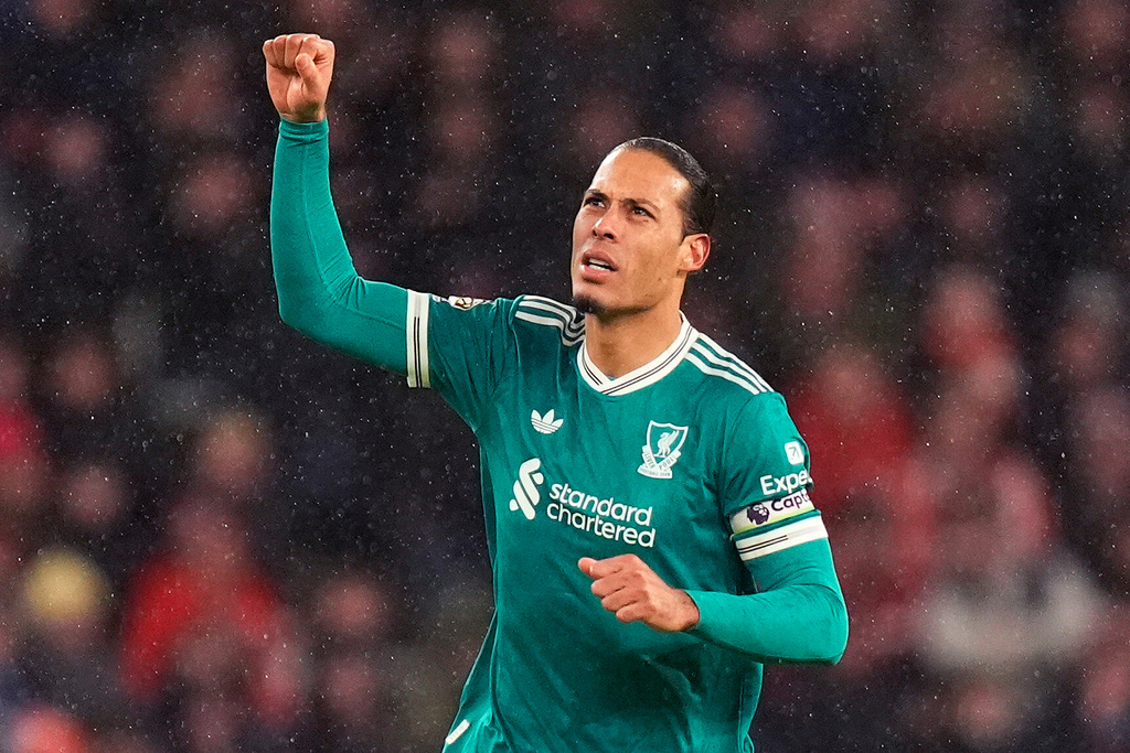 Liverpool's Virgil van Dijk celebrates scoring their side's first goal of the game during the English Premier League soccer match against Sunderland, in Sunderland, England, Wednesday, Feb. 11, 2026. (Danny Lawson/PA via AP)