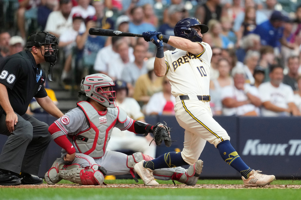 Milwaukee Brewers' Sal Frelick hits an RBI single during the fourth inning of a baseball game against the Cincinnati Reds, Tuesday, June 30, 2026, in Milwaukee. (AP Photo/Aaron Gash)