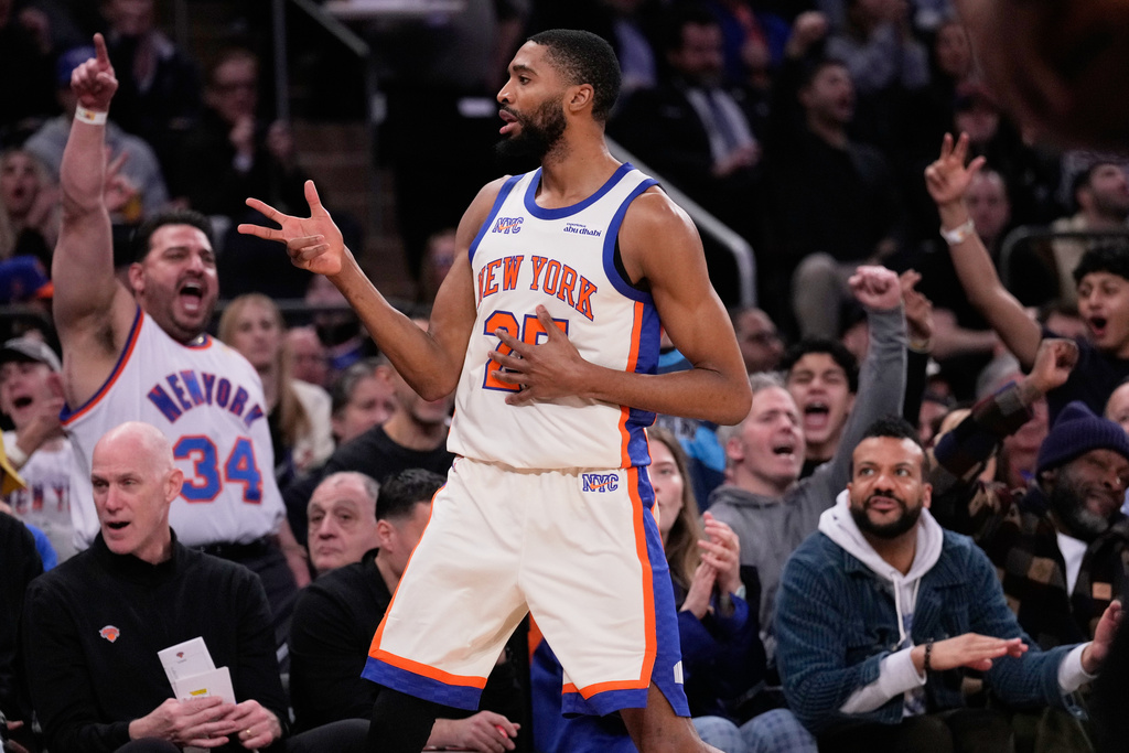 New York Knicks' Mikal Bridges reacts after a three-point basket during the first half of an NBA basketball game against the San Antonio Spurs Sunday, March 1, 2026, in New York. (AP Photo/Seth Wenig)