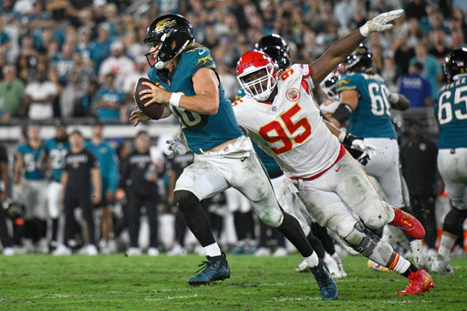 Jacksonville Jaguars quarterback Trevor Lawrence (16) gets past Kansas City Chiefs defensive tackle Chris Jones (95) as he runs the ball during the second half of an NFL football game, Monday, Oct. 6, 2025, in Jacksonville, Fla. (AP Photo/Phelan M. Ebenhack) Jacksonville Jaguars quarterback Trevor Lawrence (16) gets past Kansas City Chiefs defensive tackle Chris Jones (95) as he runs the ball during the second half of an NFL football game, Monday, Oct. 6, 2025, in Jacksonville, Fla. (AP Photo/Phelan M. Ebenhack)