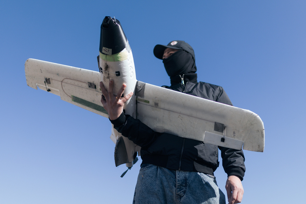 A soldier of the 127th Separate Territorial Brigade launches a drone to search for Russian attack drones at the front line in the Kharkiv region Friday, March 13, 2026. (AP Photo/Nikoletta Stoyanova)