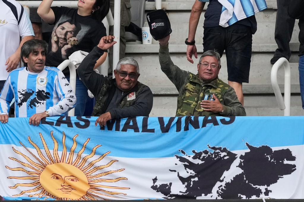 Fans hold an Argentine flag bearing an image of the Falkland Islands, also known as the Malvinas, prior to a Nations Championship rugby match between Argentina and England in Santiago del Estero, Argentina, Saturday, July 18, 2026. (AP Photo/Gustavo Garello)