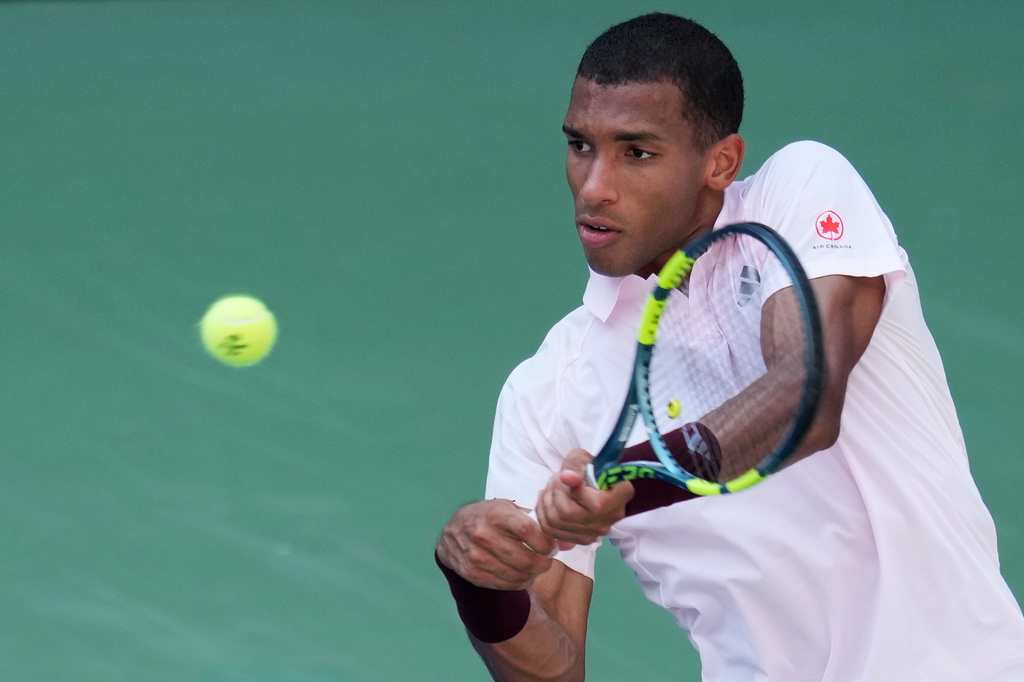 Felix Auger-Aliassime, of Canada, returns the ball to Karen Khachanov, of Russia, during the second round of the U.S. Open tennis championships Thursday, Sept. 3, 2026, in New York. (AP Photo/Seth Wenig)