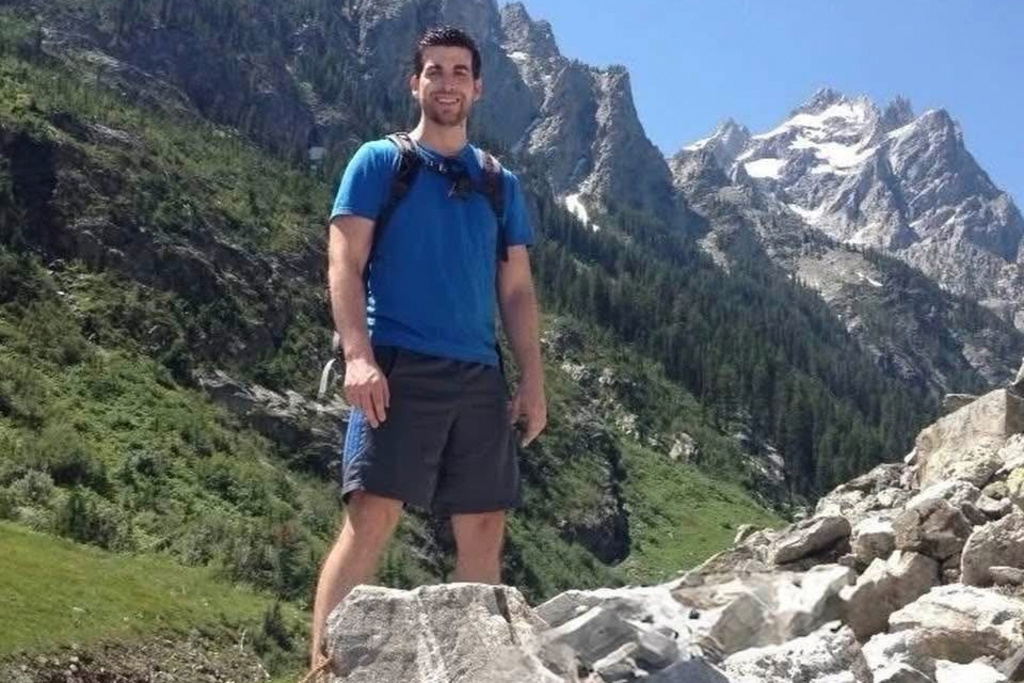 This undated photo provided by Matt Collins shows Chris Collins, who died when his plane collided with an Army helicopter over Washington D.C. on Jan. 29, 2025, standing at Grand Teton National Park in Wyoming. (Matt Collins via AP)