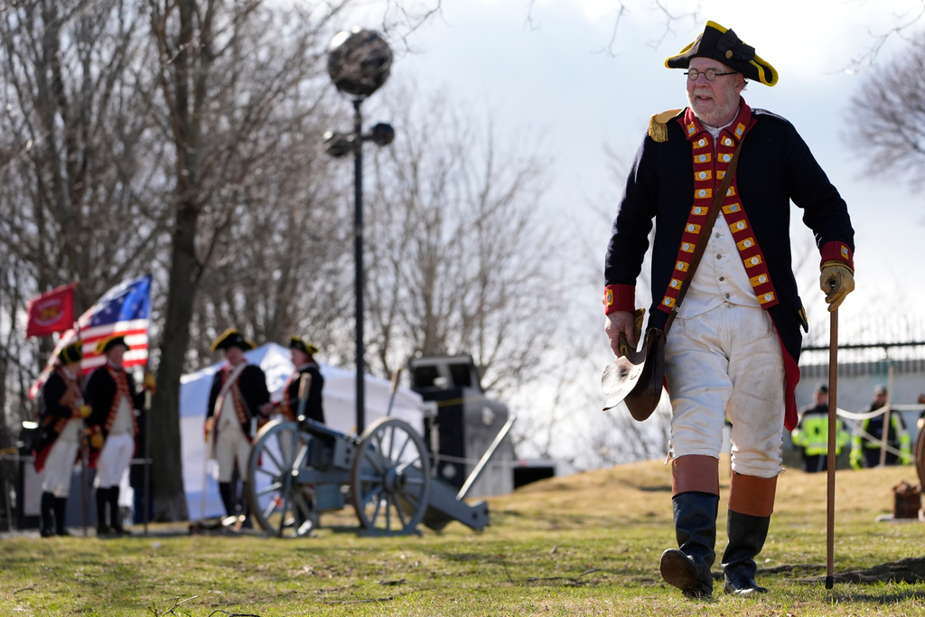 Crane's Continental Artillery reenactor Jeffrey Cooke takes part in an Evacuation Day ceremony marking the 1776 departure of British troops from the city during the American Revolutionary War, Tuesday, March 17, 2026, in Boston. (AP Photo/Robert F. Bukaty)