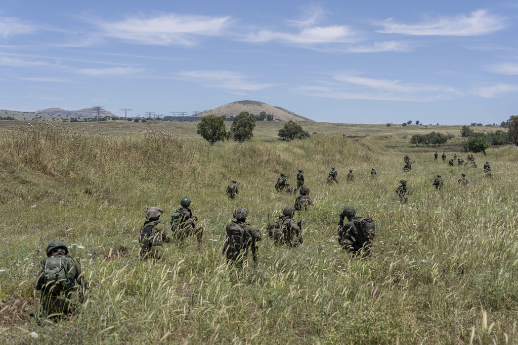 FILE - Israeli combat reservists take position during training in the Israeli-controlled Golan Heights on May 8, 2024. (AP Photo/Ohad Zwigenberg, File)