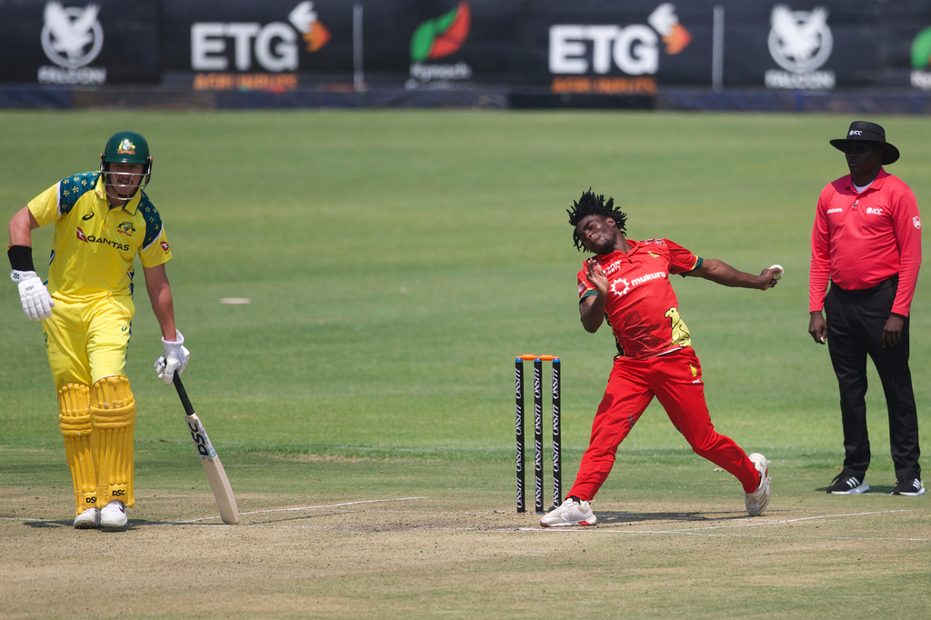 Australia's batsman Matt Renshaw, left, watches on as Zimbabwe's bowler Newman Nyamhuri bowls during the first One Day International cricket match between Zimbabwe and Australia in Harare, Zimbabwe, Tuesday, Sept.15, 2026. (AP Photo/Wonder Mashura)