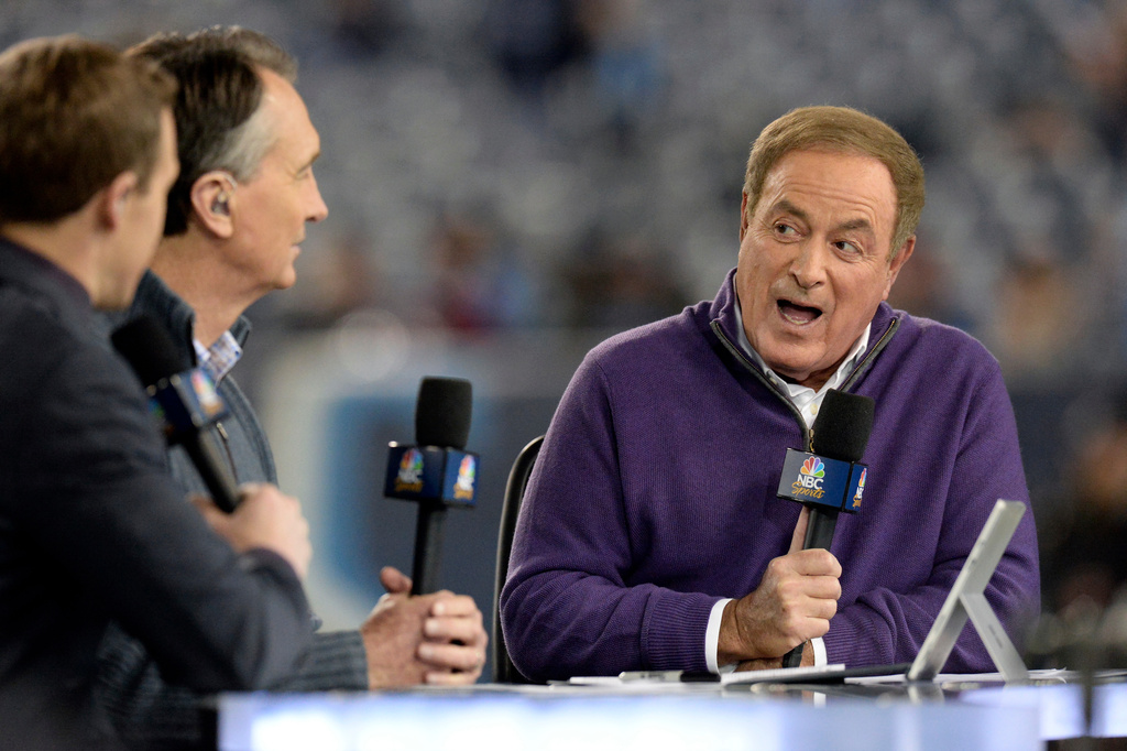 FILE - Al Michaels, right, and Cris Collinsworth, second from left, broadcast from the field before an NFL football game between the Tennessee Titans and the Indianapolis Coltsy, Dec. 30, 2018, in Nashville, Tenn. (AP Photo/Mark Zaleski, File)