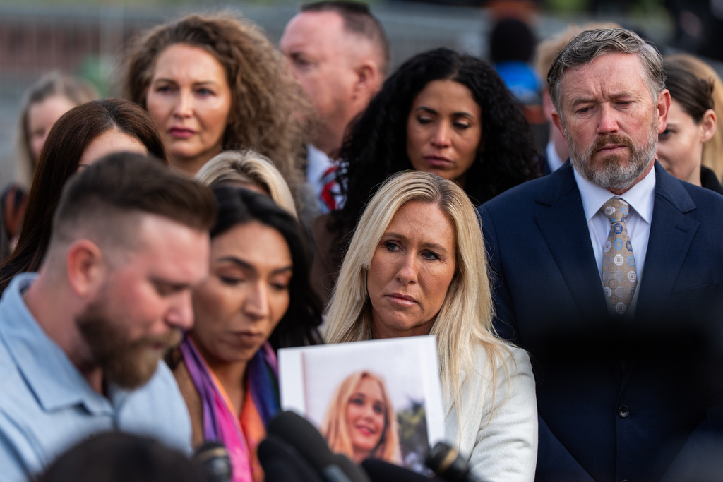 FILE - Rep. Marjorie Taylor Greene, R-Ga., second from right, and Rep. Thomas Massie, R-Ky., right, attend a news conference regarding the Epstein Files Transparency Act, outside the U.S. Capitol in Washington, Nov. 18, 2025. (AP Photo/Julia Demaree Nikhinson, File)