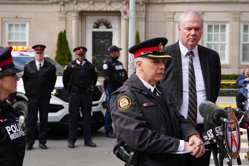 Frank Barredo, deputy chief of the Toronto Police Service, speaks outside the U.S. consulate during a news conference as Chief Superintendent Chris Leather, right, the officer in charge of criminal operations for the Royal Canadian Mounted Police, looks on, Tuesday, March 10, 2026, in Toronto. (Frank Gunn/The Canadian Press via AP)