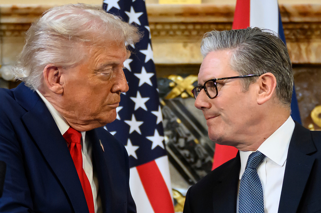 FILE - U.S. President Donald Trump, left, and British Prime Minister Keir Starmer look at each other as they shake hands during a press conference at Chequers near Aylesbury, England, Sept. 18, 2025. Leon Neal/Pool Photo via AP, File)