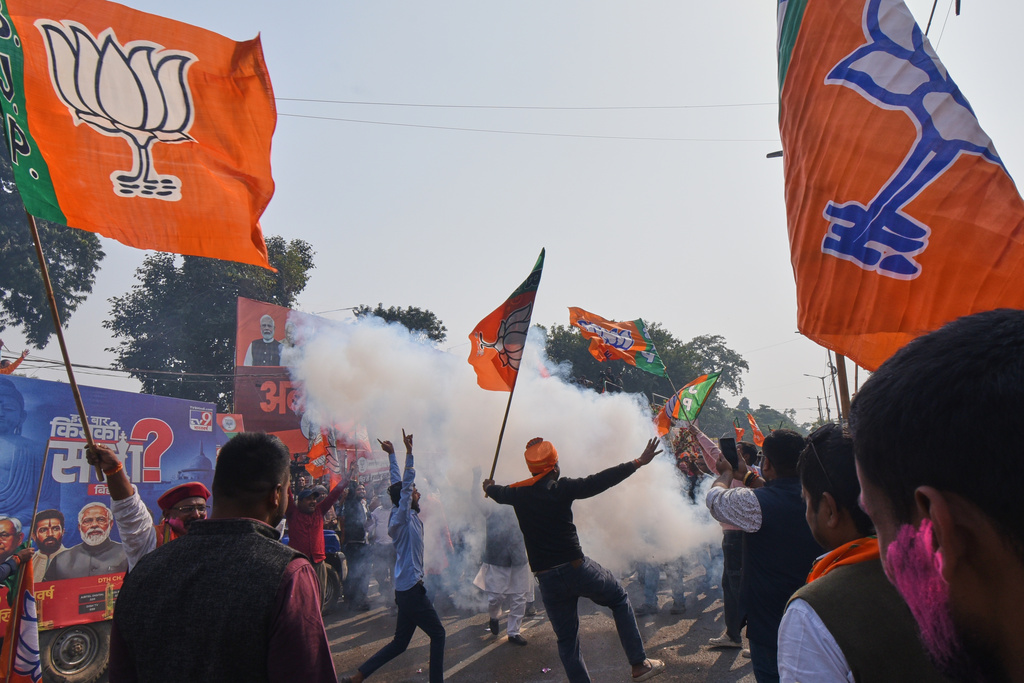 Supporters of Bharaiya Janata party celebrate the early leads in Bihar state election results in Patna, India, Friday, Nov.14, 2025. (AP Photo)