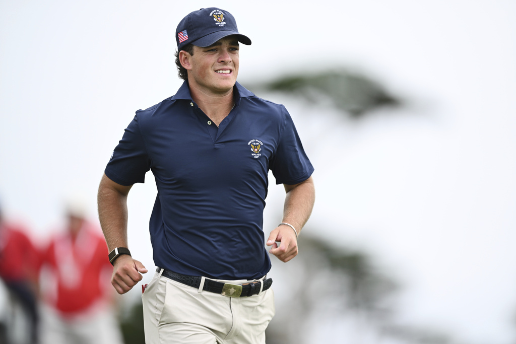 The USA team's Jackson Koivun walks on the 16th hole during Walker Cup golf matches against the Great Britain and Ireland team at Cypress Point Club on Sunday, Sept. 7, 2025, in Pebble Beach, Calif. (AP Photo/Thien-An Truong)