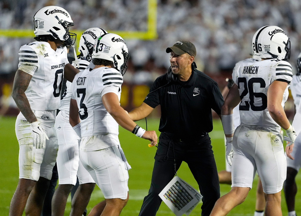 Iowa State head coach Matt Campbell celebrates with is team after a touchdown by quarterback Rocco Becht (3) during the second half of an NCAA college football game against Arizona , Saturday, Sept. 27, 2025, in Ames, Iowa. Iowa State won 39-14. (AP Photo/Matthew Putney)