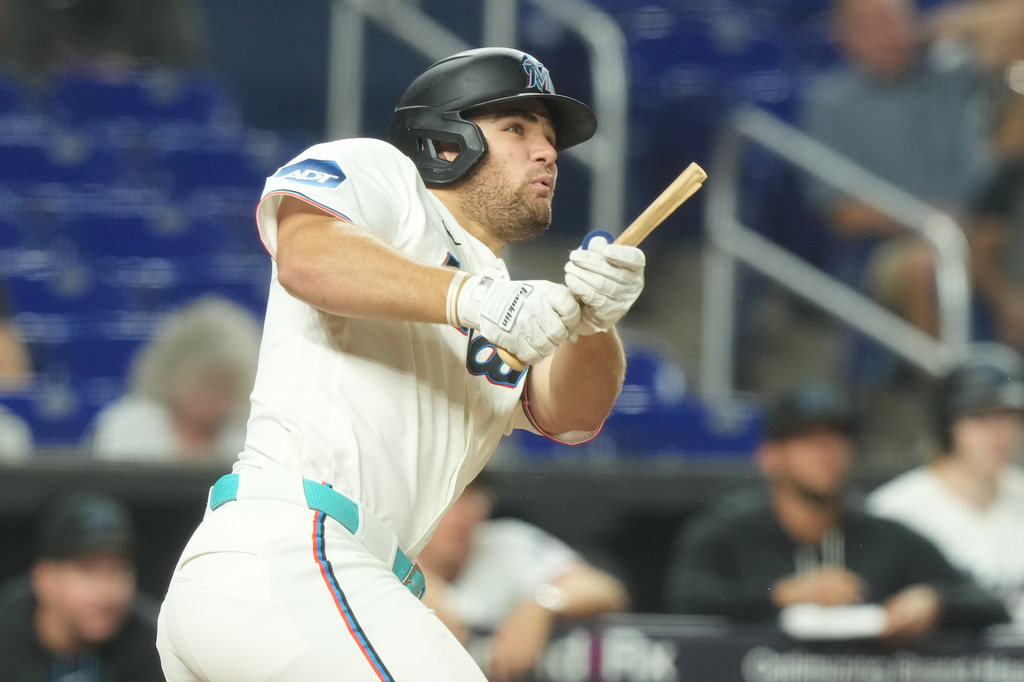 Miami Marlins' Jakob Marsee breaks his bat after hitting a single during the ninth inning of a baseball game against the New York Mets Wednesday, Sept. 9, 2026, in Miami. (AP Photo/Marta Lavandier)
