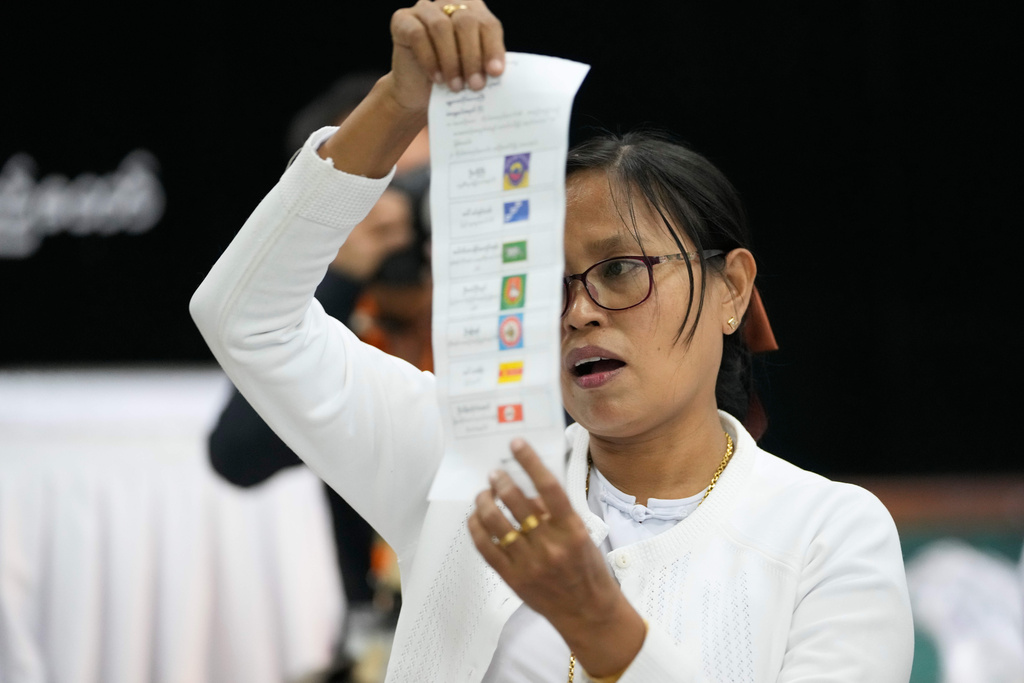 An official of the Union Election Commission counts ballots at a polling station, during the first phase of general election, in Naypyitaw, Myanmar, Sunday, Dec. 28, 2025. (AP Photo/Aung Shine Oo)