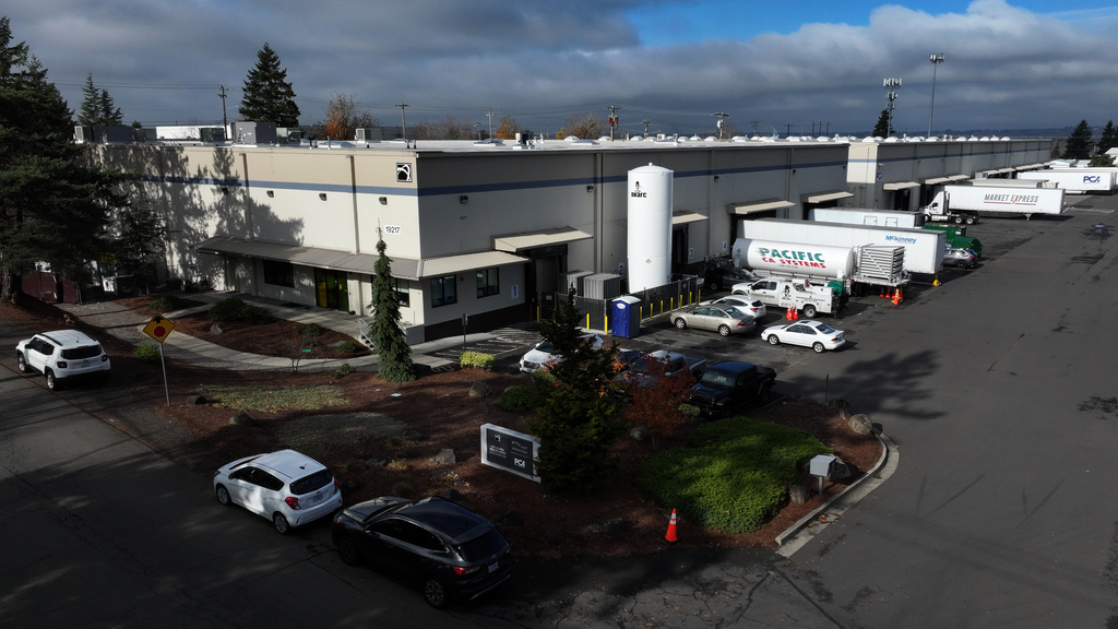 A sign for ByHeart, a manufacturer of organic baby formula, is displayed outside a building that houses a plant for the company on Tuesday, Nov. 11, 2025, in Portland, Ore. (AP Photo/Jenny Kane)