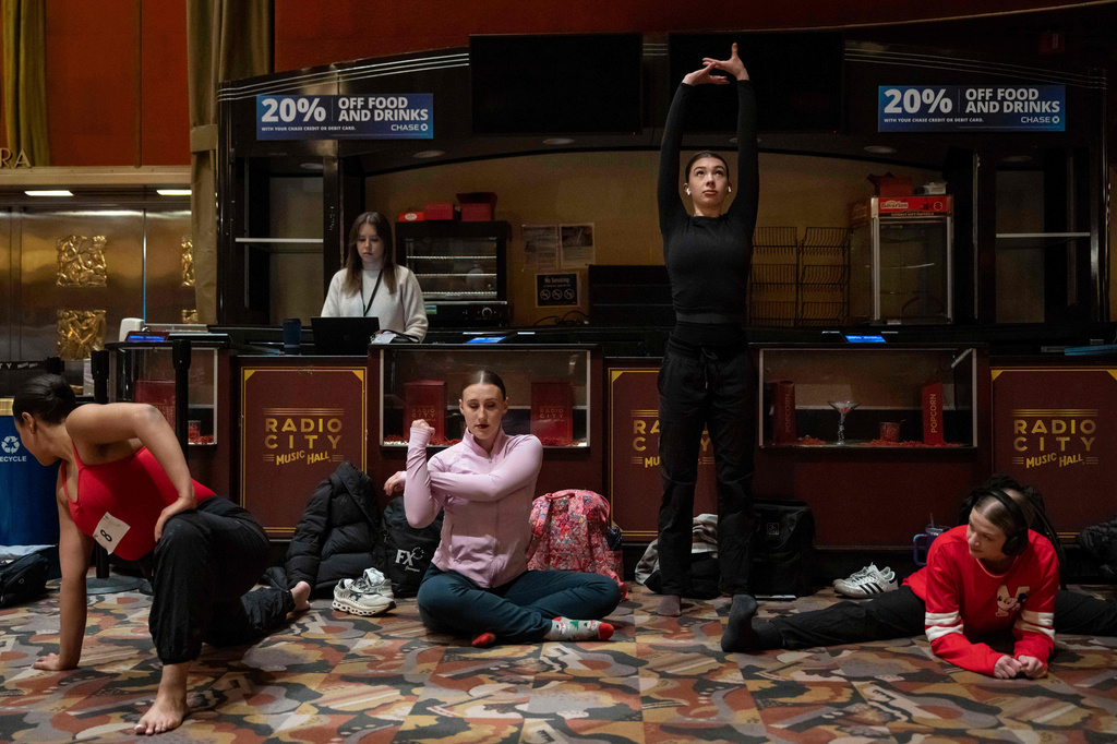 Dancers warm up and stretch before an audition for the Radio City Rockettes at Radio City Music Hall in New York, on Wednesday, April 22, 2026. (AP Photo/Yuki Iwamura)