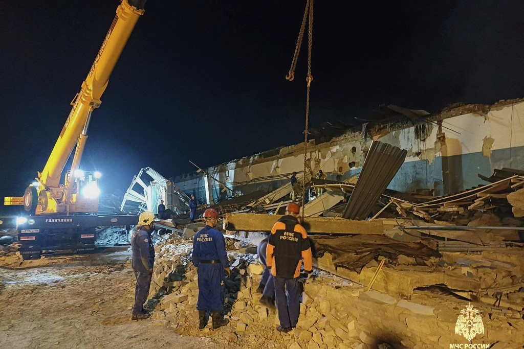 In this photo, released by the Russian Emergency Ministry Press Service on Saturday, Aug. 16, 2025, Emergency Ministry employees work in debris of an industrial plant after a fire at the facility in the Shilovsky District, Ryazan region, around 250 kilometers (155 miles) southeast of Moscow, Russia. (Russian Emergency Ministry Press Service via AP)