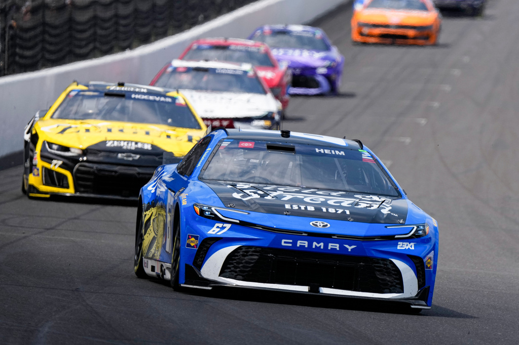 Corey Heim heads into the first turn during the NASCAR Cup Series auto race at Indianapolis Motor Speedway in Indianapolis, Sunday, July 26, 2026. (AP Photo/Michael Conroy)