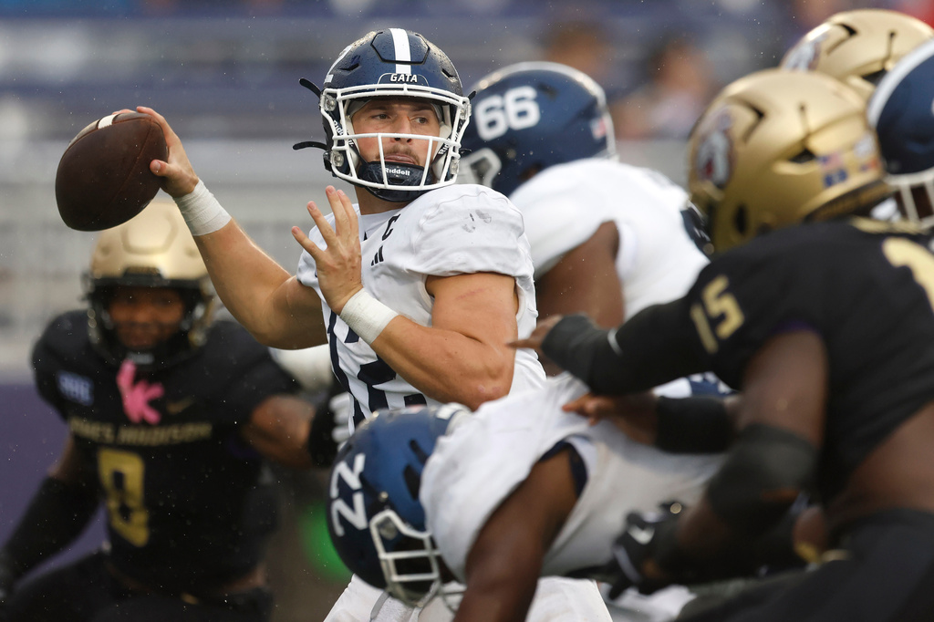 FILE - Georgia Southern quarterback JC French IV (12) looks to pass during the fourth quarter of an NCAA football game against James Madison on Sept. 27, 2025, in Harrisonburg, Va. James Madison won 35-10. (AP Photo/Mike Buscher, File)