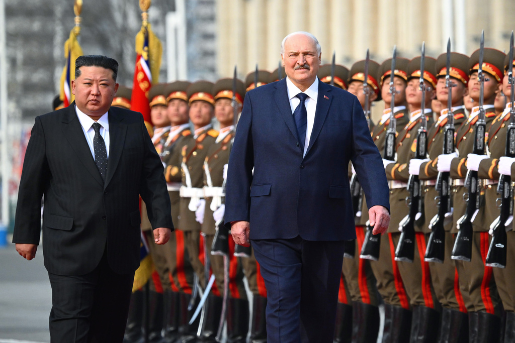 In this photo released by Belarus' Presidential Press Service, North Korea's leader Kim Jong Un, left, and Belarusian President Alexander Lukashenko attend an official meeting ceremony in Pyongyang, North Korea, Wednesday, March 25, 2026. (Belarus' Presidential Press Service via AP)