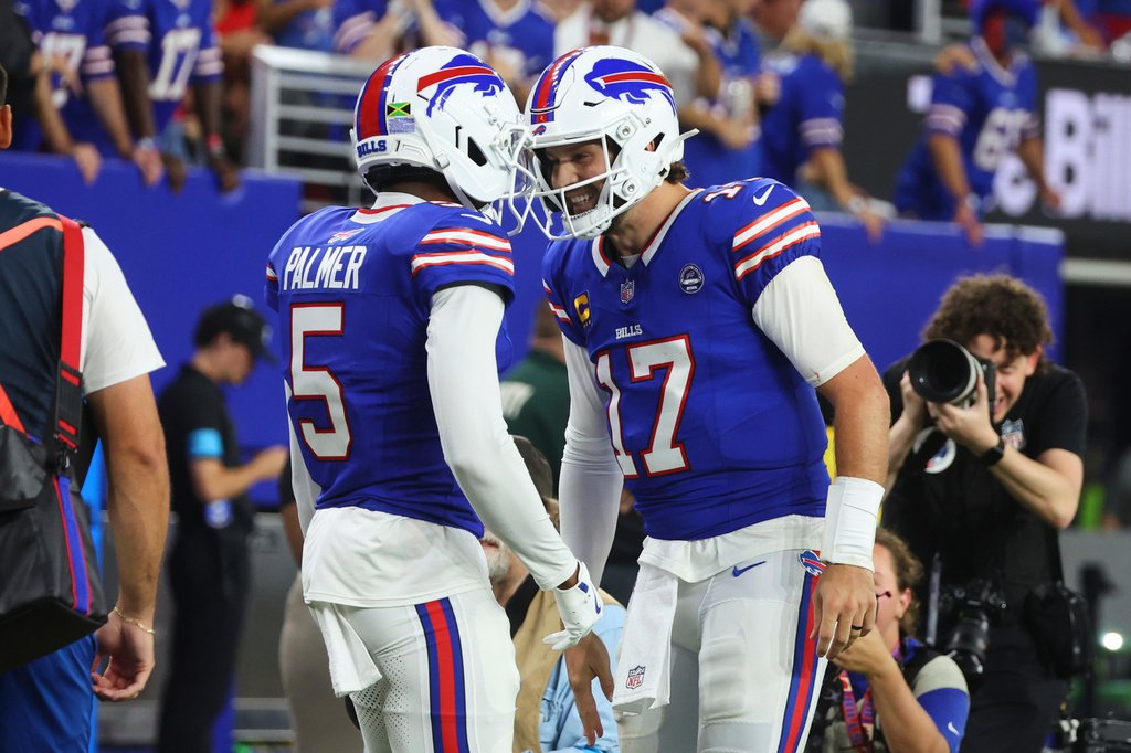 Buffalo Bills wide receiver Josh Palmer (5) and quarterback Josh Allen (17) celebrate their touchdown against the Detroit Lions during the first half of an NFL football game in Orchard Park, N.Y., Thursday, Sept. 17, 2026. (AP Photo/Jeffrey T. Barnes)
