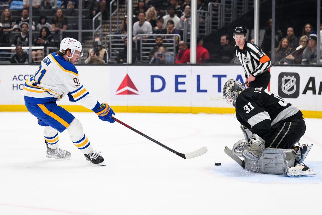 Los Angeles Kings goaltender Anton Forsberg (31) blocks a shot by Buffalo Sabres right wing Josh Doan during the first period of an NHL hockey game Saturday, March 21, 2026, in Los Angeles. (AP Photo/William Liang)