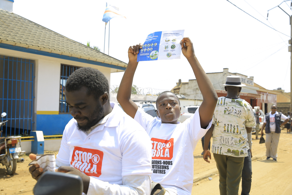 Residents and frontline workers embark on Ebola outbreak awareness campaign in Beni, North Kivu province, eastern Congo, Friday, Aug. 21, 2026. (AP Photo/Sebastien Kitsa Musayi)