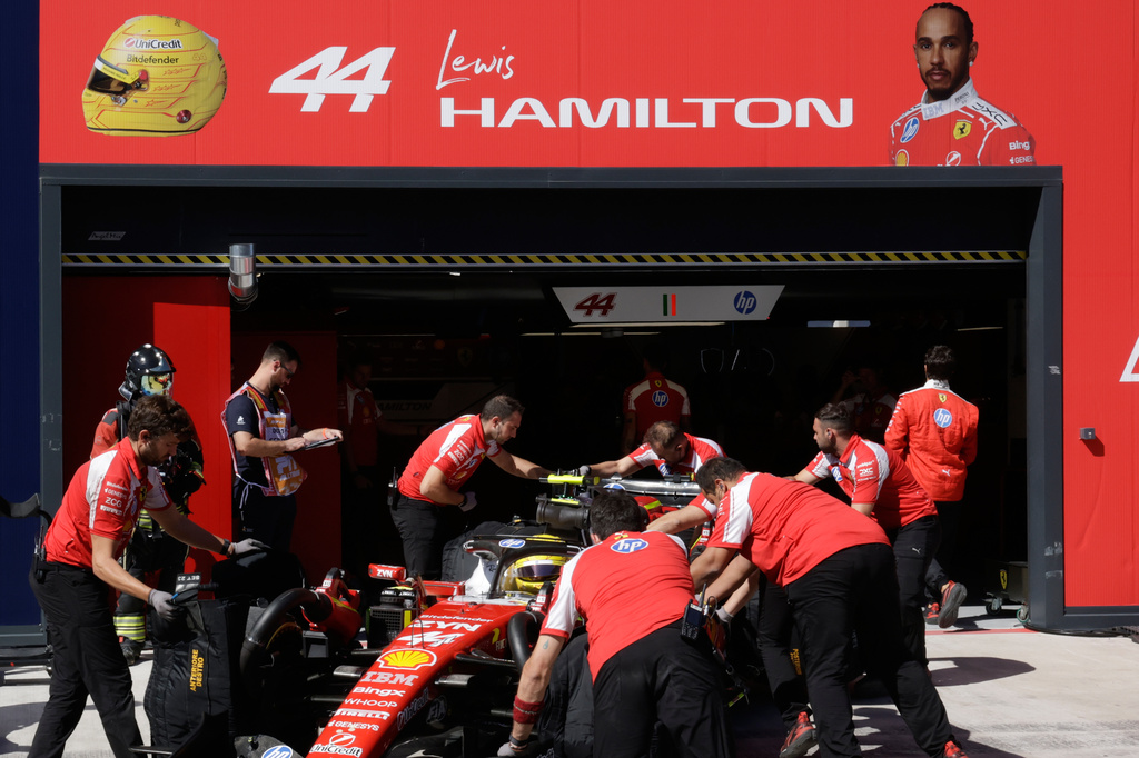 Ferrari driver Lewis Hamilton of Britain gets pushed back into his garage during the qualifying session for the Spanish Formula One Grand Prix in Madrid, Saturday, Sept. 12, 2026. (Violeta Santos Moura/Pool Photo via AP)
