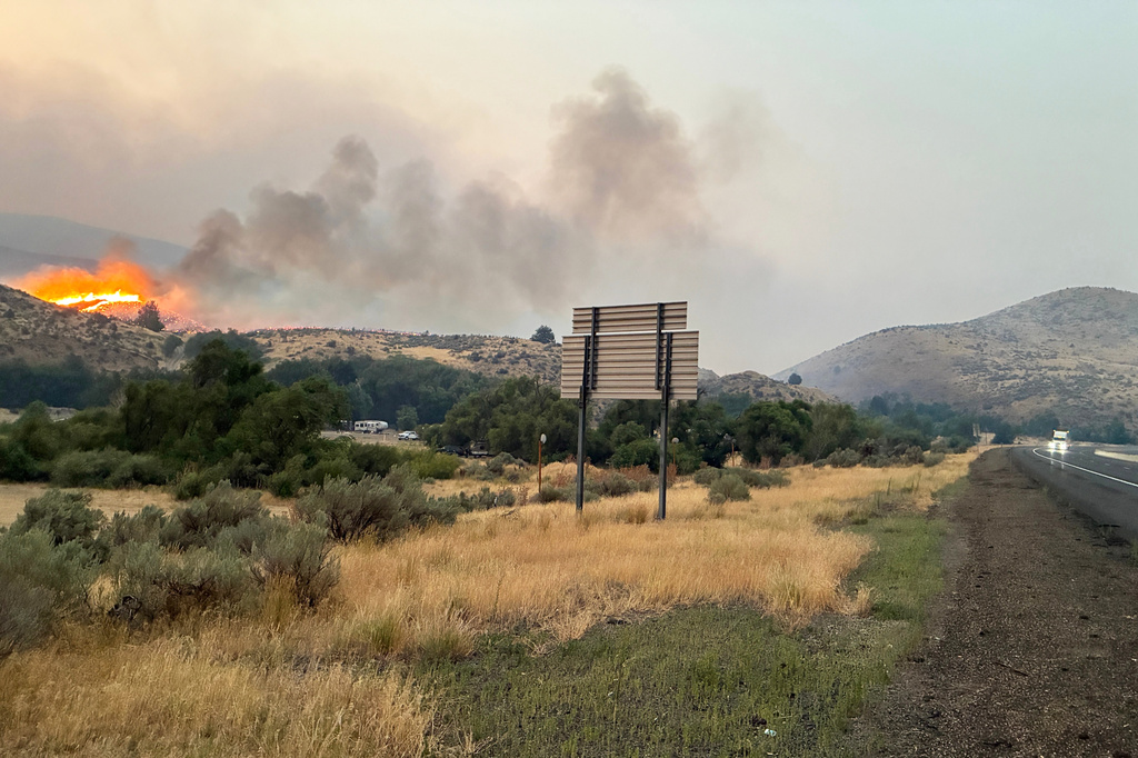 This undated photo provided by the Oregon Department of Transportation on Monday, July 27, 2026, shows the Fox Fire burning in eastern Oregon. (Oregon Department of Transportation via AP)