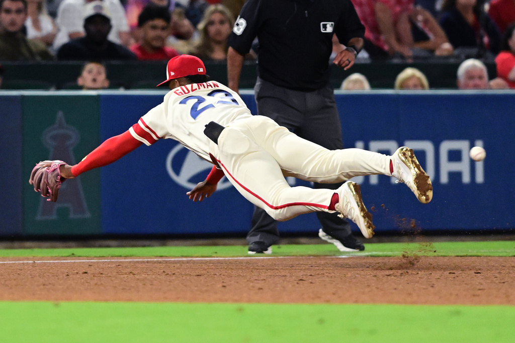 Los Angeles Angels Denzer Guzman dives but can't make the catch on a RBI double by Houston Astros Cam Smith during the sixth inning of a baseball game Wednesday, July 29, 2026, in Anaheim, Calif. (AP Photo/Wally Skalij)