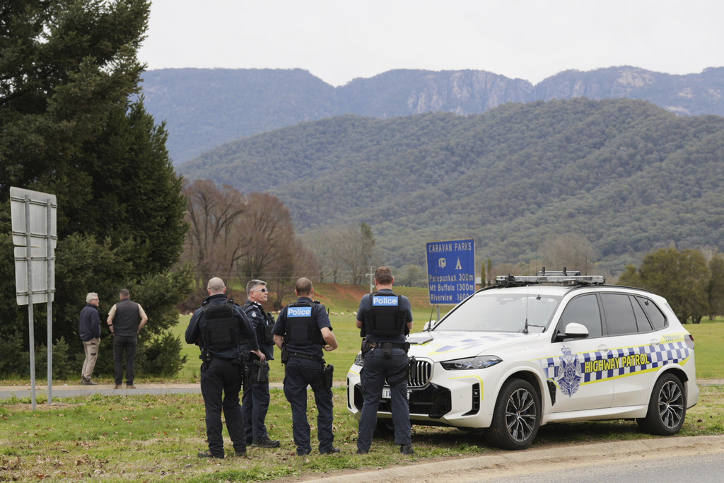 Police wait near the scene of a shooting in the high country of Porepunkah in the state of Victoria, Australia, Tuesday, Aug. 26, 2025.(Simon Dallinger/AAP Image via AP)