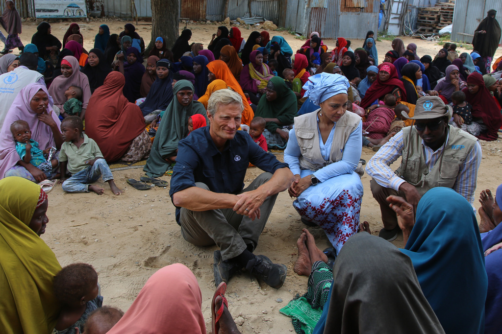 Acting Executive Director of the World Food Programme (WFP) Carl Skau, center, meets Somali women displaced by drought at Feynuus Nutrition Centre on the outskirts of the capital, Mogadishu, Somalia, Wednesday, Aug. 19, 2026. (AP Photo/Farah Abdi Warsameh)