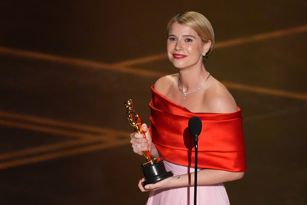 Jessie Buckley accepts the award for actress in a leading role for "Hamnet" during the Oscars on Sunday, March 15, 2026, at the Dolby Theatre in Los Angeles. (AP Photo/Chris Pizzello)
