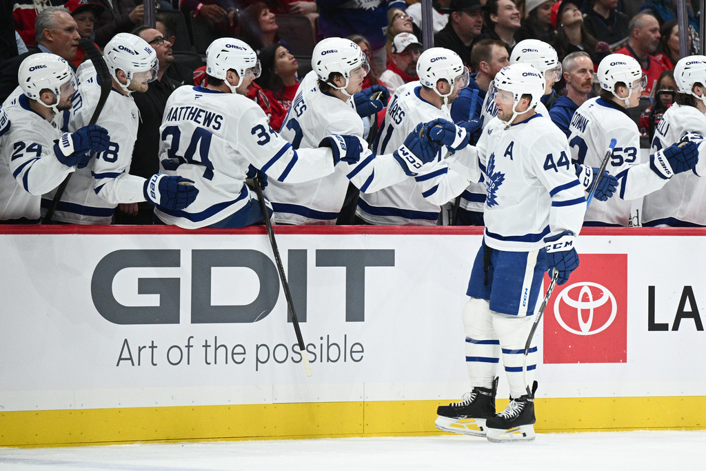 Toronto Maple Leafs defenseman Morgan Rielly (44) celebrates his goal during the first period of an NHL hockey game against the Washington Capitals, Friday, Nov. 28, 2025, in Washington. (AP Photo/Nick Wass)