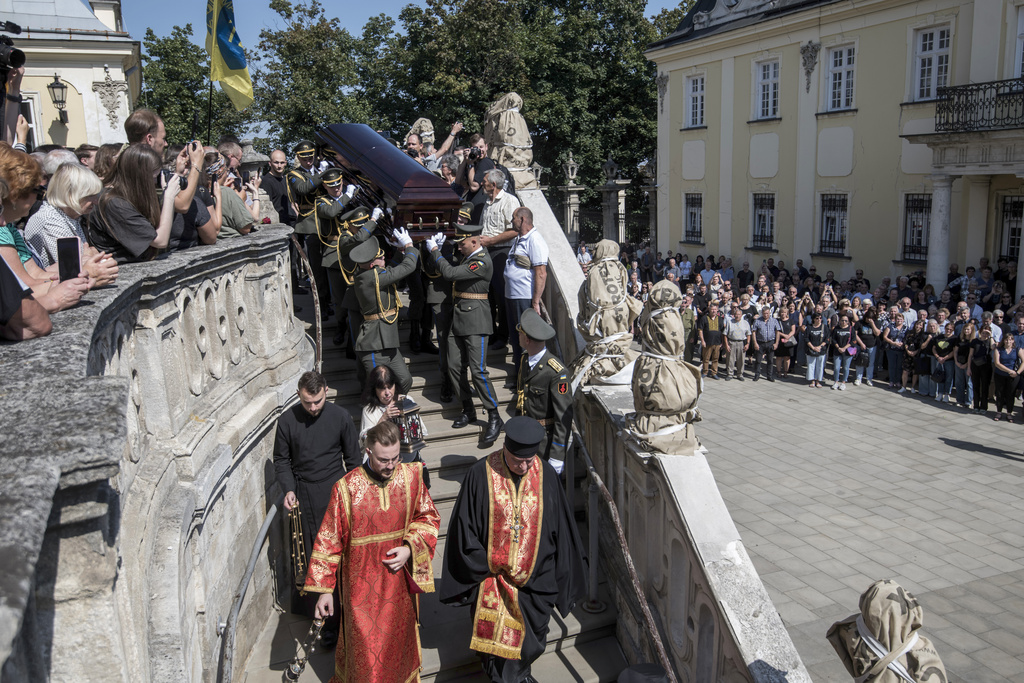 Soldiers carry the coffin of former Ukrainian parliament speaker Andriy Parubiy, who was killed last Saturday in Lviv, Ukraine, Tuesday, Sept. 2, 2025. (AP Photo/Vladyslav Musiienko)