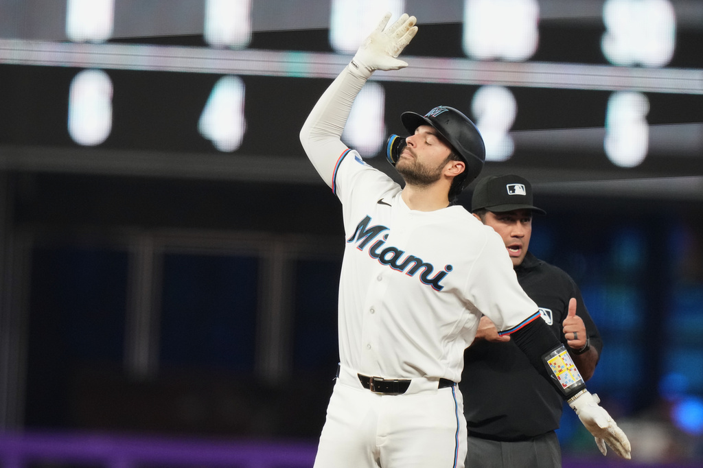 Miami Marlins' Joe Mack reacts after hitting a double during the fifth inning of a baseball game against the Washington Nationals, Saturday, May 9, 2026, in Miami. (AP Photo/Lynne Sladky)