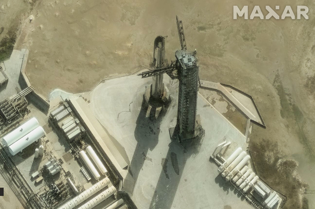 SpaceX catches its Starship rocket back at the launch pad, but the ...