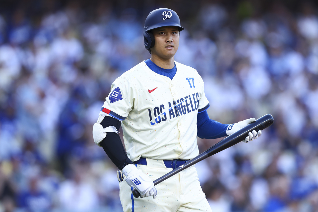 Los Angeles Dodgers designated hitter Shohei Ohtani looks on before his first at bat during the first inning of a baseball game against the Toronto Blue Jays, Saturday, Aug. 9, 2025, in Los Angeles. (AP Photo/Jessie Alcheh)