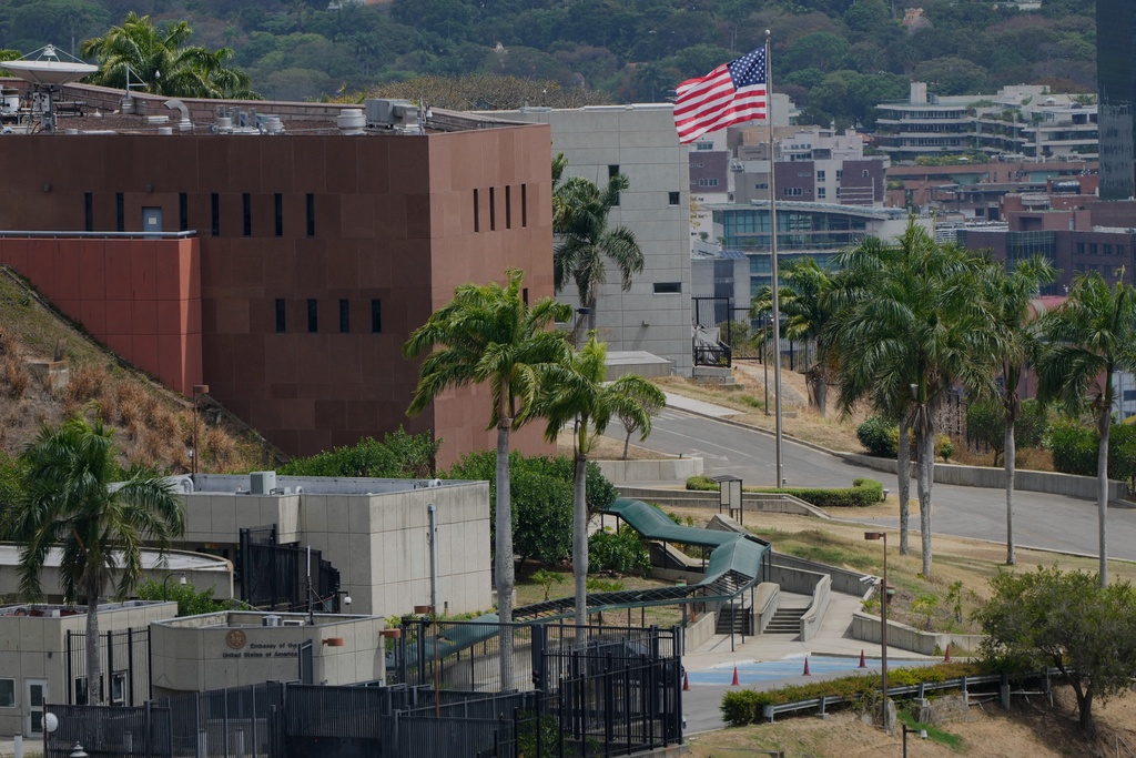 An American flag flies again at the US Embassy in Caracas, Venezuela, Saturday, March 14, 2026, seven years after it was lowered when Washington and Caracas cut diplomatic relations in 2019. (AP Photo/Ariana Cubillos)