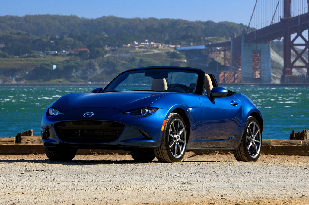 This photo provided by Mazda shows a 2019 MX-5 Miata. Thanks to its light weight and nimble handling, a Miata is best enjoyed with its top down while driving along a twisty road. (Courtesy of Mazda North American Operations via AP)
