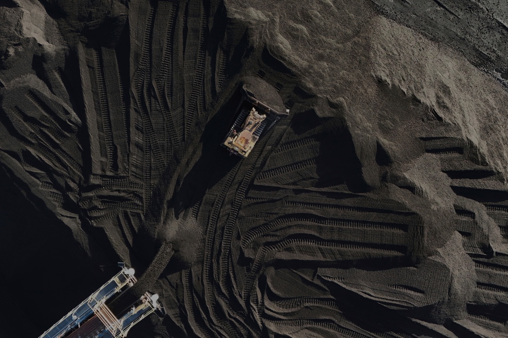 FILE - A bulldozer moves coal April 10, 2025, in Princeton, Ind. (AP Photo/Joshua A. Bickel, File)