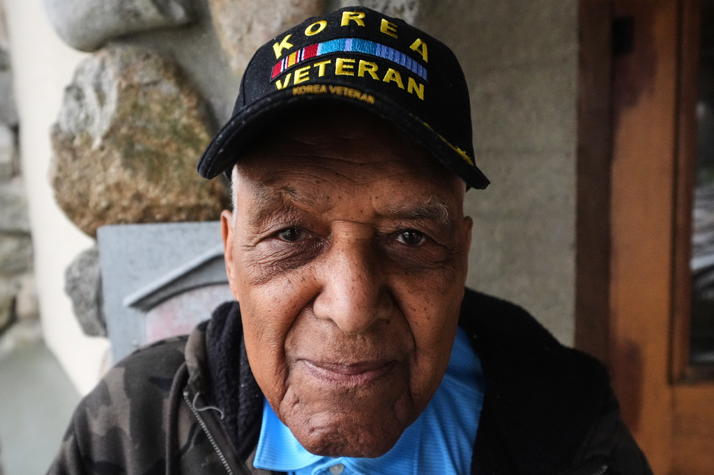 Revolutionary War re-enactor Charles Price, 95, who for decades portrayed enslaved Minuteman Prince Estabrook, poses for a portrait near the village green, Monday, April 13, 2026, in Lexington, Mass. (AP Photo/Charles Krupa)