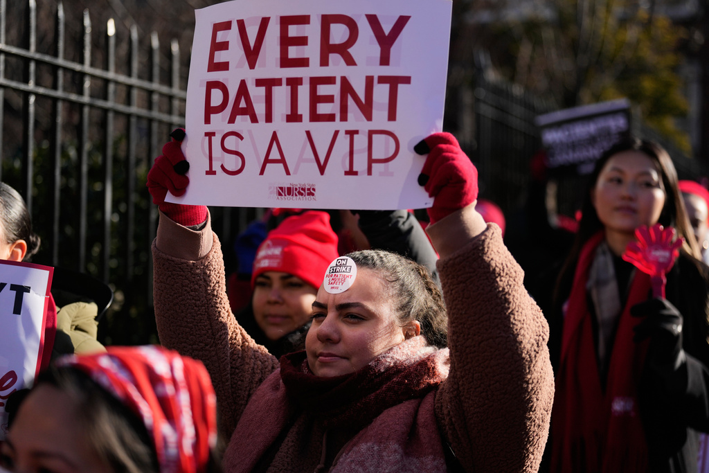 Nurses strike in front of Montefiore Hospital in the Bronx borough of New York, Tuesday, Jan. 13, 2026. (AP Photo/Seth Wenig)