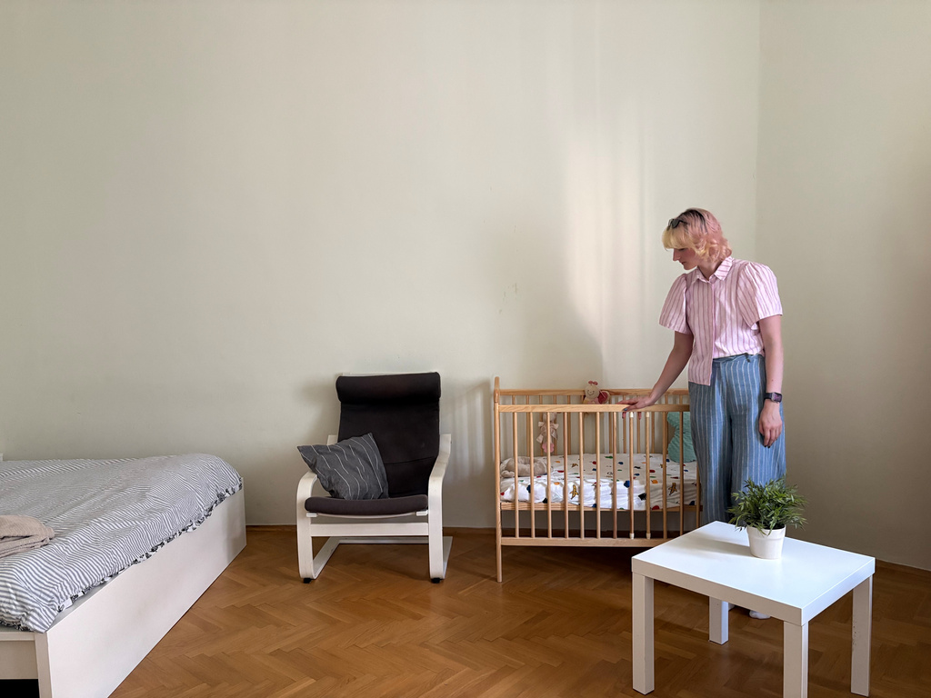Nastya Podorozhnya stands in one of the two bedrooms of the shelter which the Martynka non-profit is running in Krakow, Poland, Thursday, July 2, 2026. (AP Photo/Claudia Ciobanu)